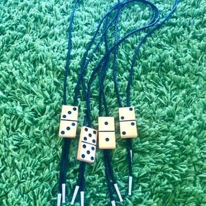 - Vintage Bakelite domino bolo tie